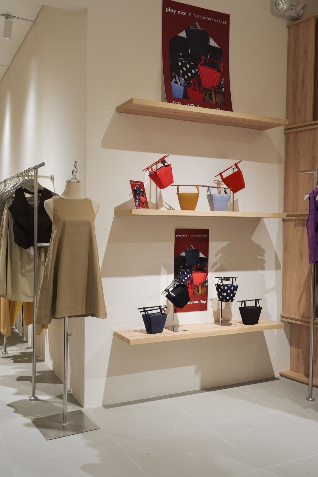 Close-up of custom shelving and circular overhead lighting inside The Editor's Market