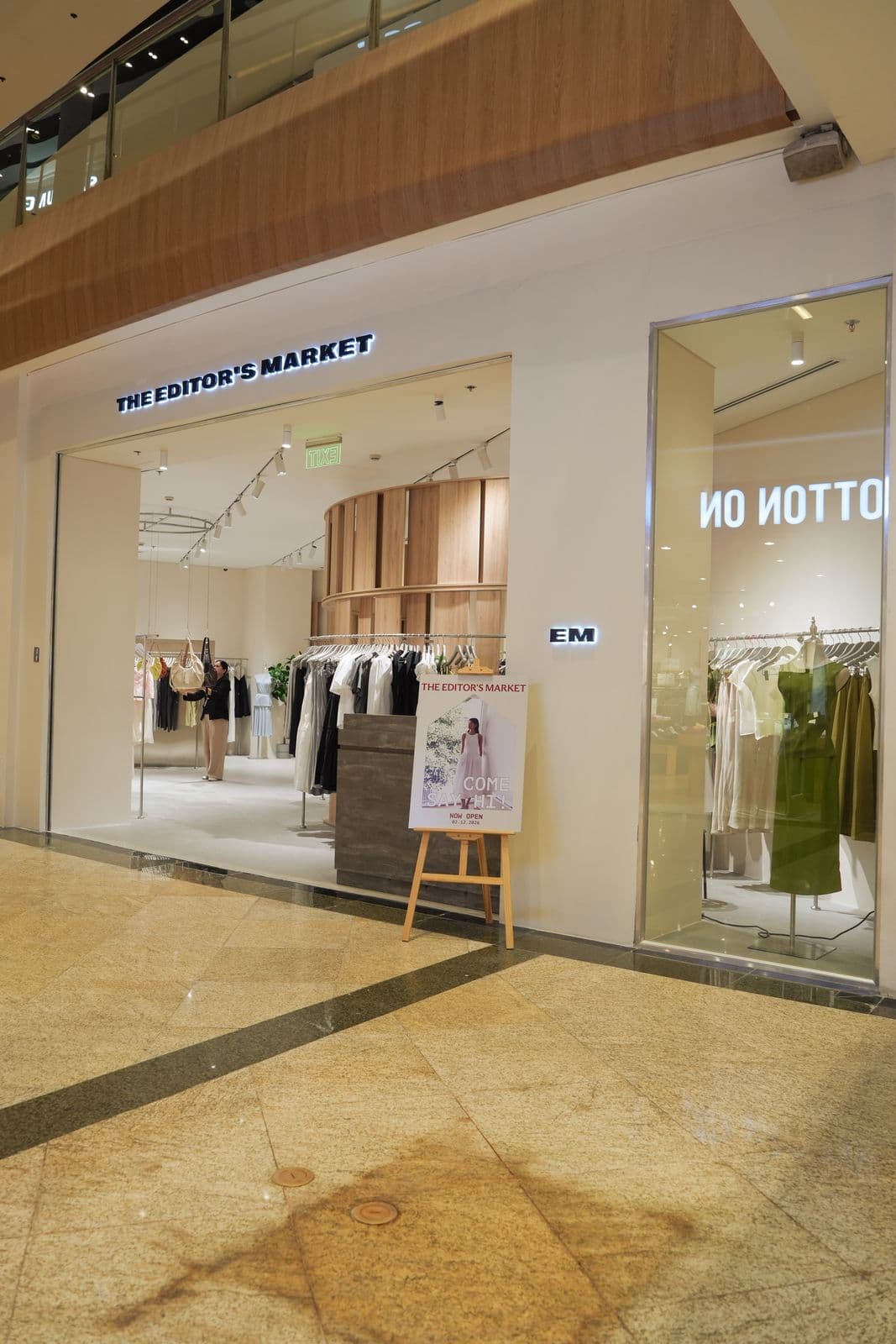 The Editor's Market entrance showing minimalist display windows and brand signage
