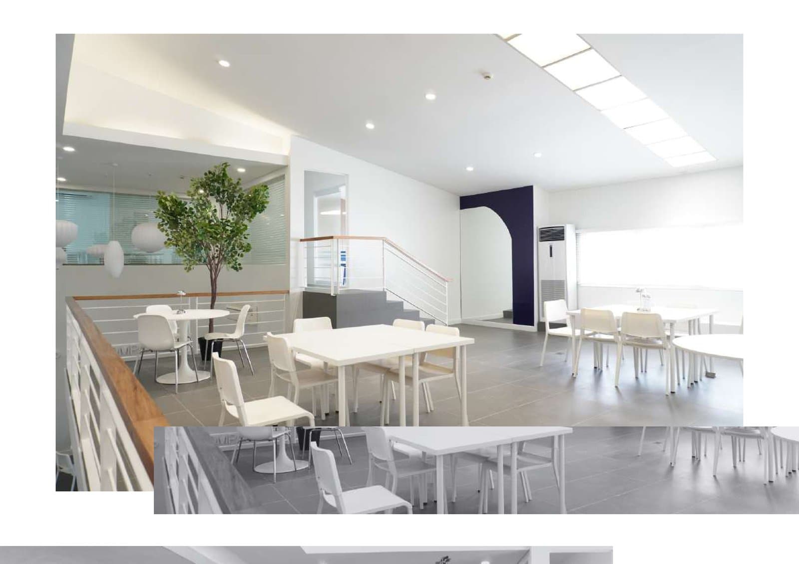 Mezzanine level overlooking open-plan office with timber railing details