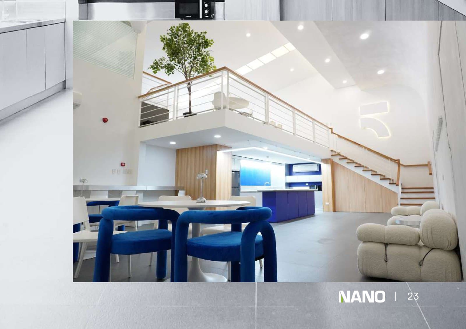 Feature staircase connecting two office levels with wood and metal railings