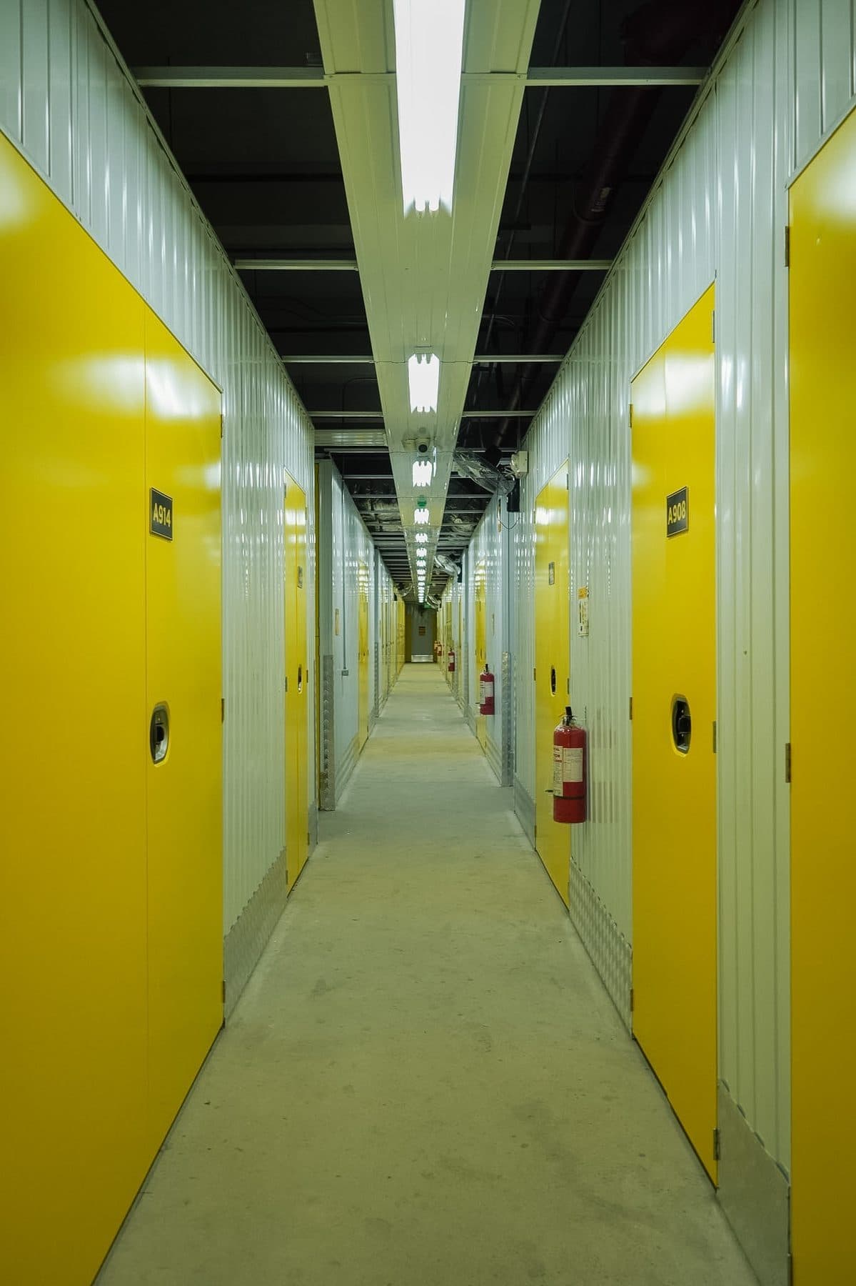 One Storage corridor with rows of color-coded unit doors